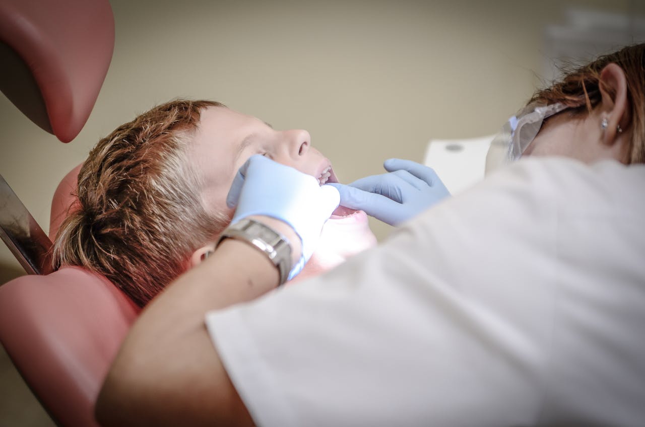 Photo of Child Having Teeth Examined