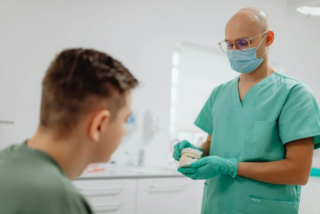 Dentist Showing Patient Teeth