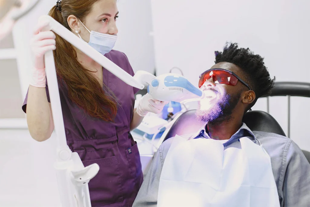 Man having teeth whitening